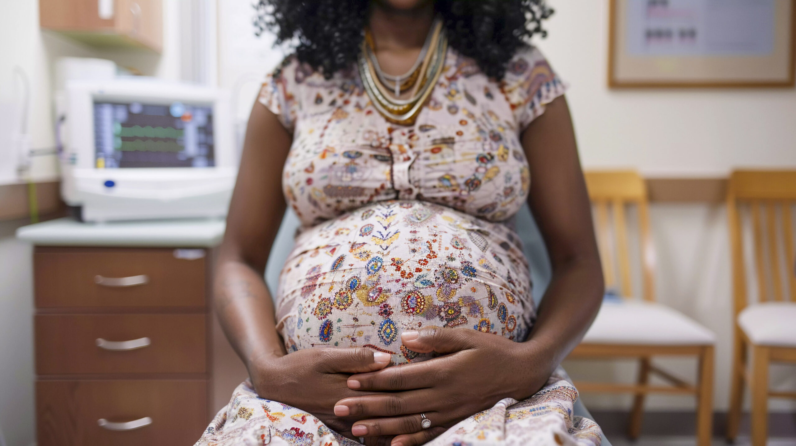 Black pregnant woman in doctor office
